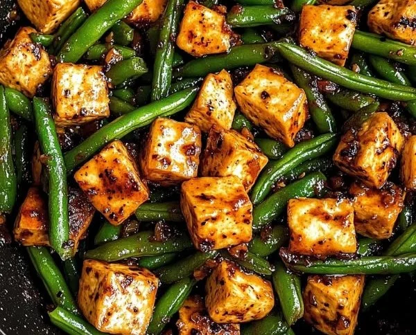 Crispy black pepper tofu with green beans served in a bowl