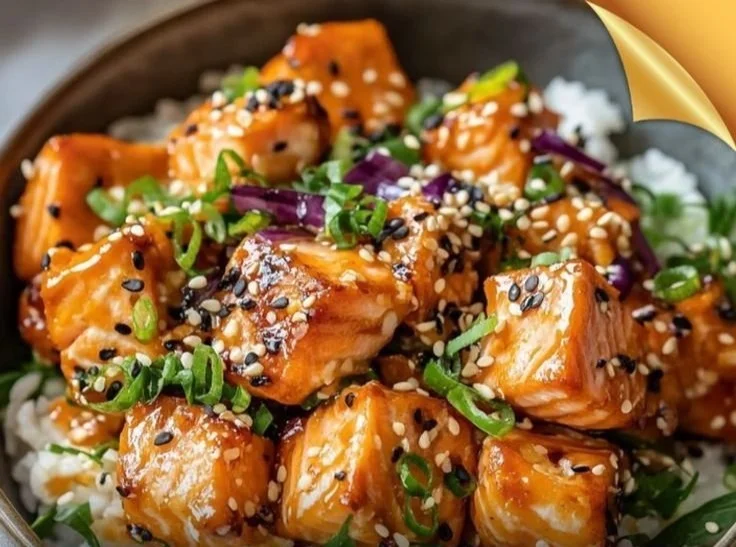 Crispy salmon rice bowl with fresh vegetables and fluffy rice