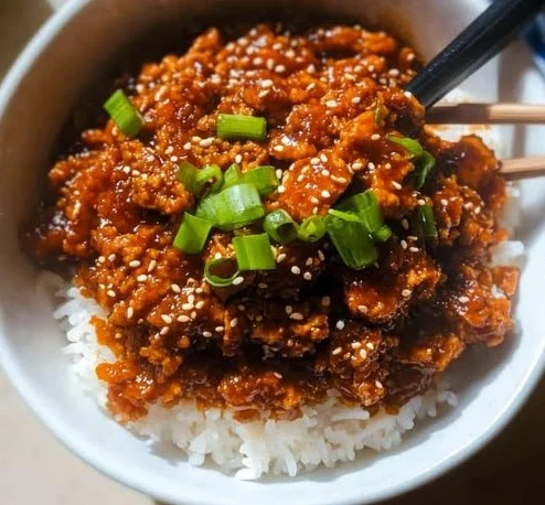 Crispy shredded tofu bulgogi bowl garnished with fresh vegetables