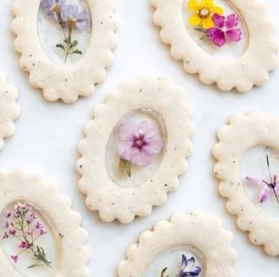 Vegan gluten-free Earl Grey stained glass floral cookies on a decorative plate