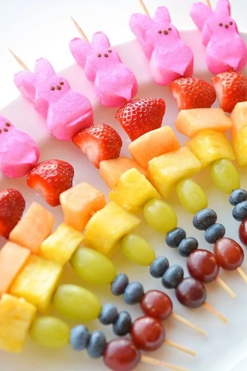Easter Peeps fruit kabobs with colorful fruit and marshmallow Peeps on skewers