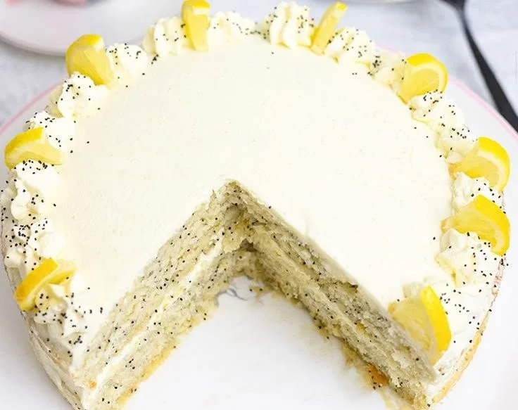 Delicious Easy Lemon Birthday Cake with frosting and lemon zest decoration
