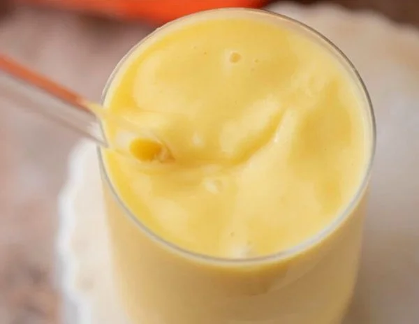 Glass of easy McDonald's mango pineapple smoothie with tropical fruits