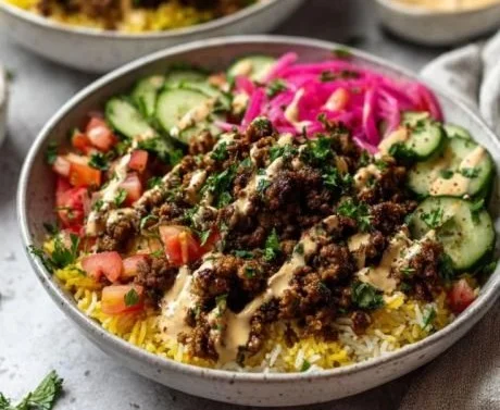 Delicious ground beef shawarma bowl with fresh veggies and sauces