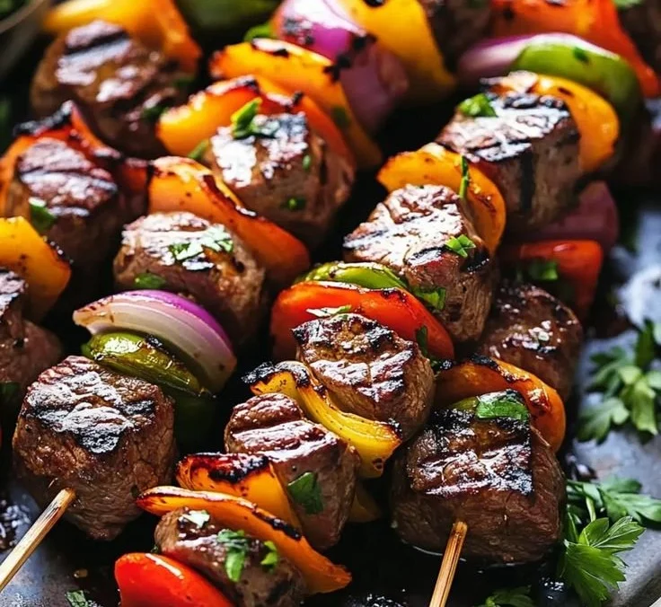 Juicy steak kebabs marinated and ready for summer grilling