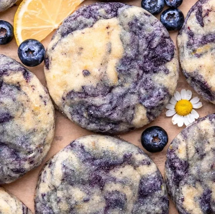 A plate of lemon blueberry cheesecake cookies, highlighting their creamy texture and fruity topping.