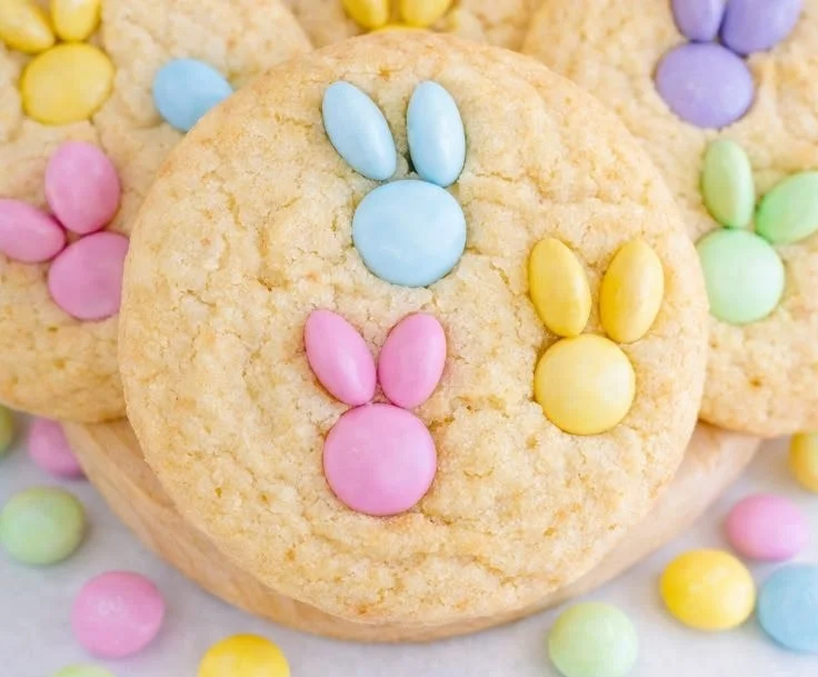 Freshly baked M&M Bunny Cookies on a decorative plate for Easter