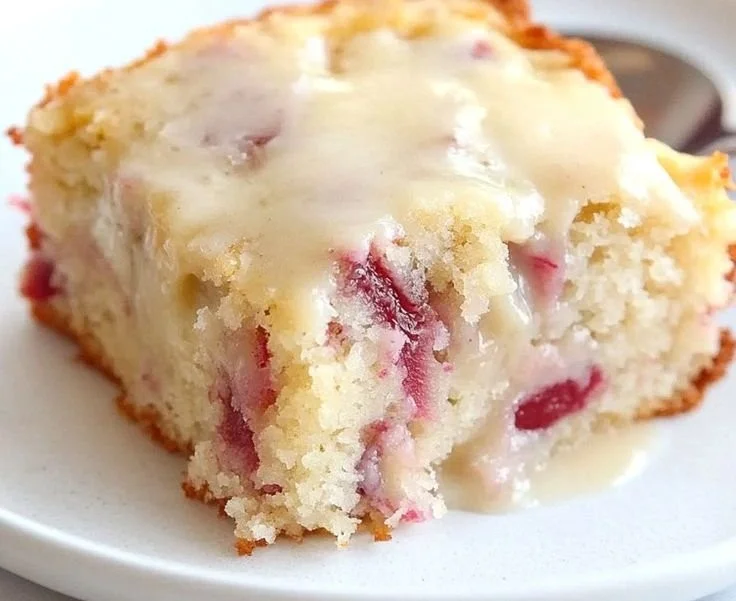 Moist Rhubarb Cake with Butter Sauce served on a plate
