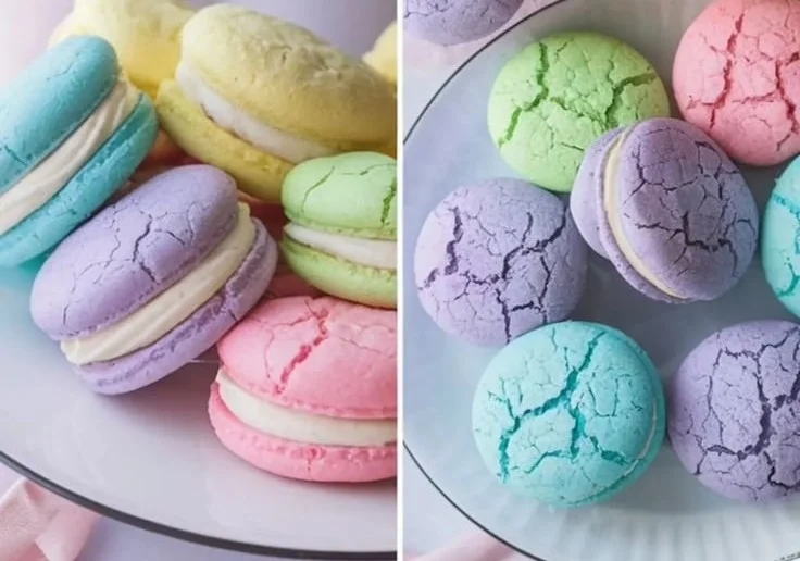 Pastel sugar cookie sandwiches filled with cream on a decorative plate.