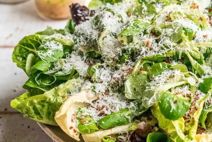A delicious homemade restaurant-style vinaigrette drizzled over fresh salad.