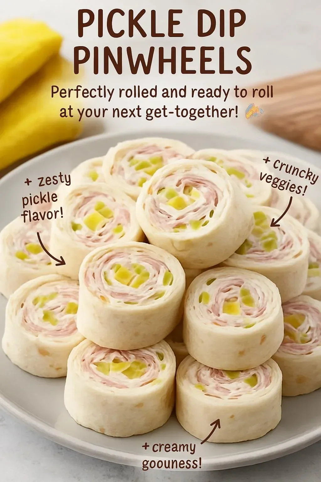Delicious pickle dip pinwheels served on a platter, perfect for appetizers.