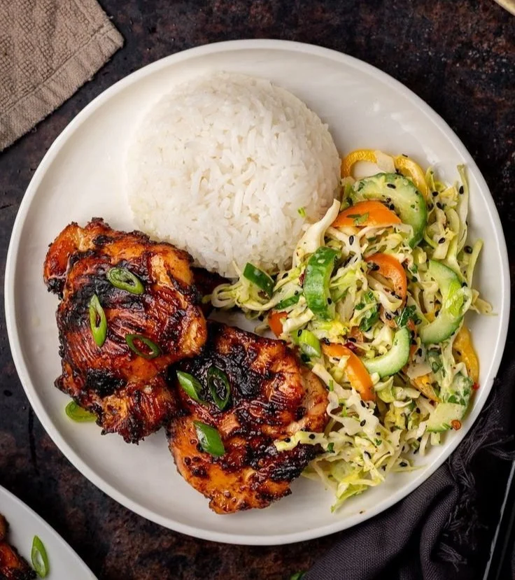 Roasted miso chicken thighs garnished with vegetables