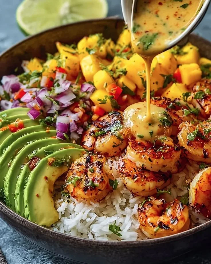 Shrimp avocado bowl with mango salsa and lime-chili sauce