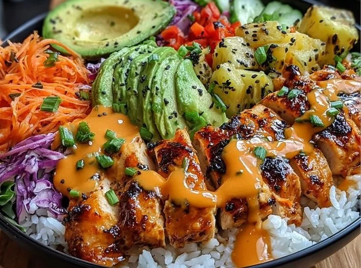 Plate of Spicy Maple Chicken with Coconut Rice garnished with herbs