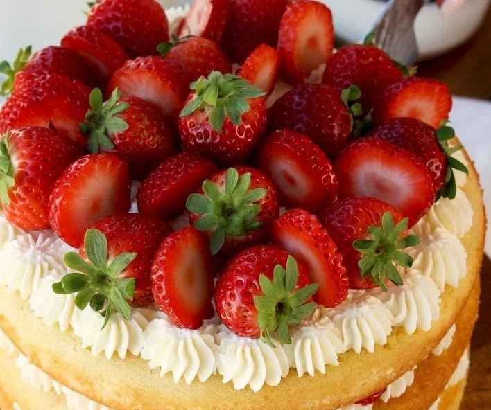 Delicious Strawberry Shortcake Cake with fresh strawberries and whipped cream
