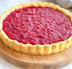 Delicious sweet rhubarb custard tart with a flaky crust and creamy filling