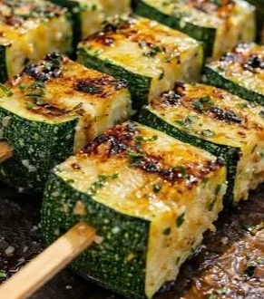 Garlic butter zucchini skewers ready for grilling, showcasing vibrant veggies and flavor.