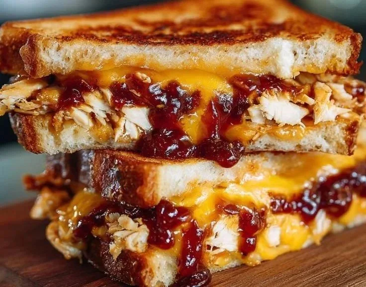 Delicious BBQ chicken grilled cheese sandwich with melted cheese and barbecue sauce