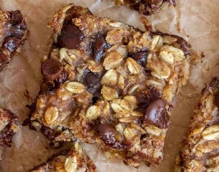 Homemade Banana Oatmeal Bars stacked on a plate, perfect for a healthy snack.