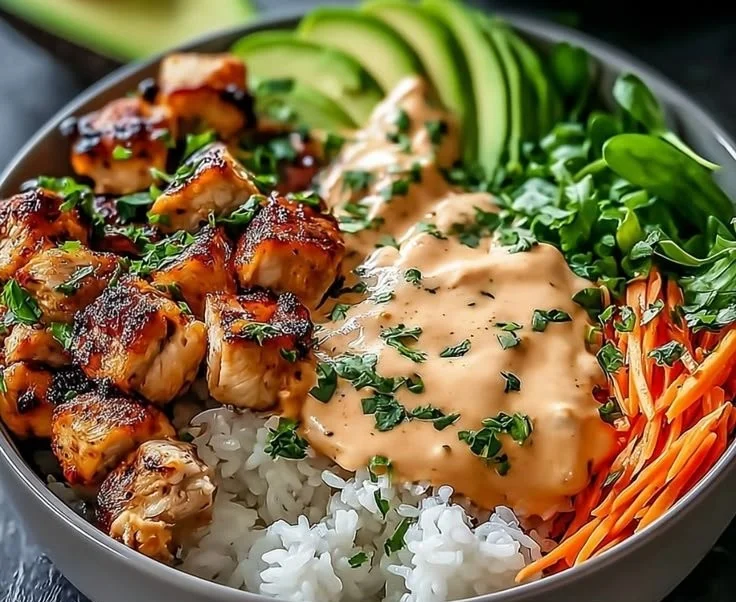 Delicious Bang Bang Chicken Bowl with crispy chicken, rice, and vegetables
