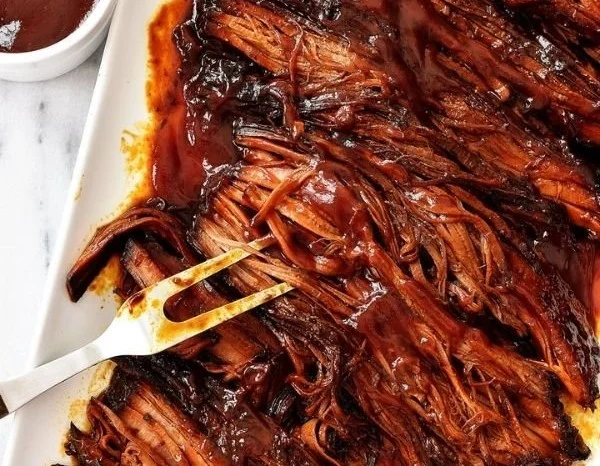Deliciously smoked BBQ brisket served with sides