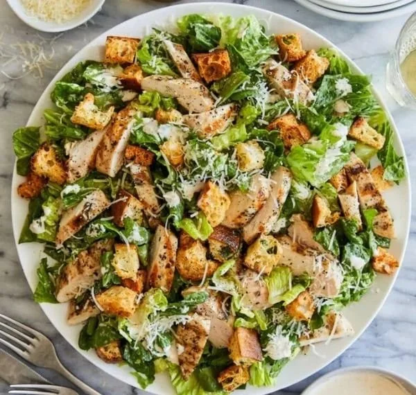 Plate of the best Chicken Caesar Salad with grilled chicken, romaine, and croutons