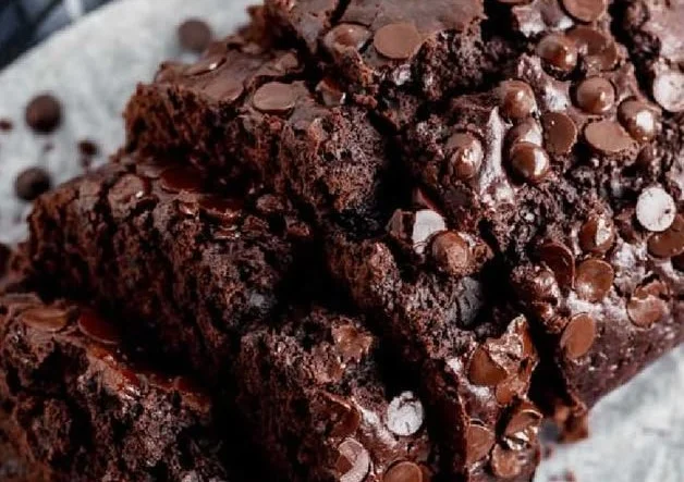 Delicious slice of chocolate zucchini bread with chocolate chips and zucchini slices