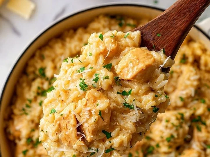 Plate of Garlic Parmesan Chicken with Rice garnished with herbs