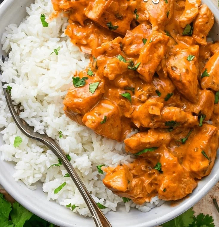 Delicious Coconut Chicken Rice Bowl with tender chicken and coconut cream sauce
