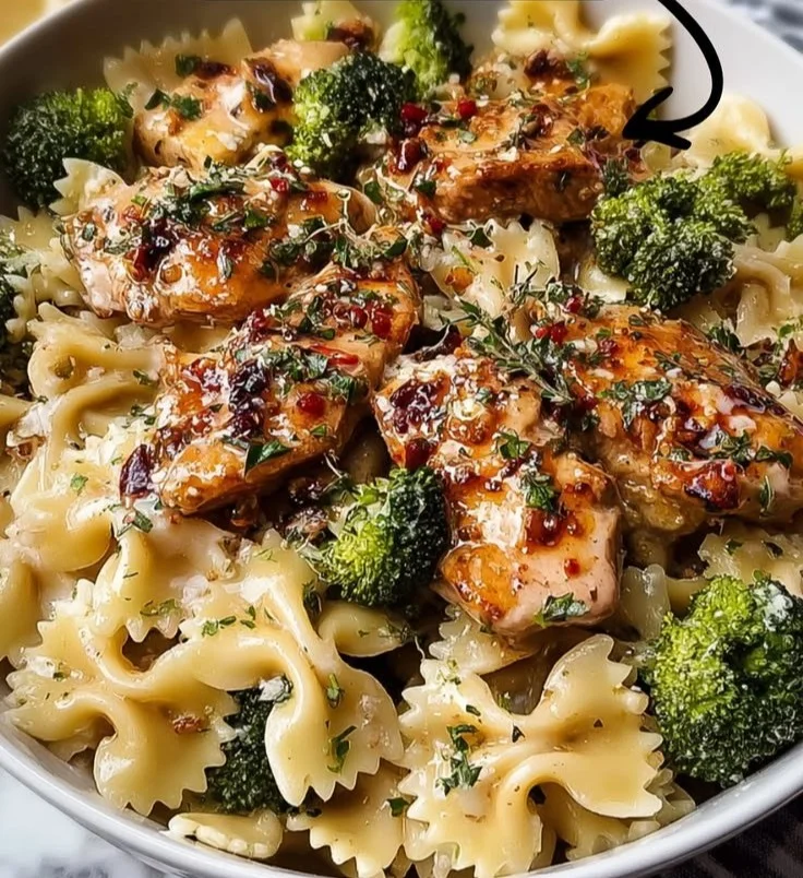 Cowboy Butter Lemon Bowtie Chicken served with broccoli on a plate