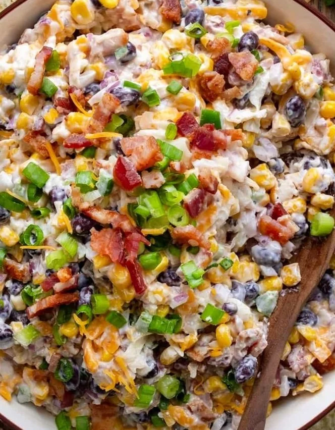 Delicious Cowboy Corn Dip served in a dish with tortilla chips on the side.