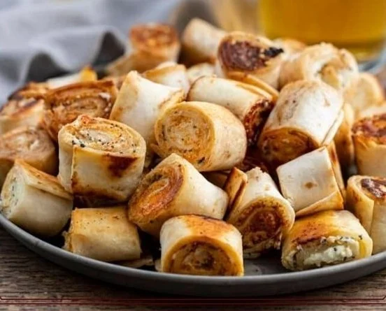 Plate of cream cheese tortilla bites ready to serve, delicious and bite-sized.