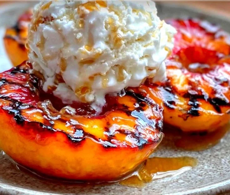Grilled peach dessert with honey and vanilla ice cream