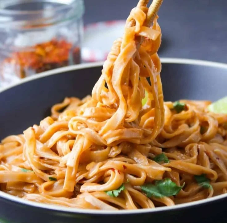 Delicious homemade Pad Thai with shrimp, vegetables, and peanuts