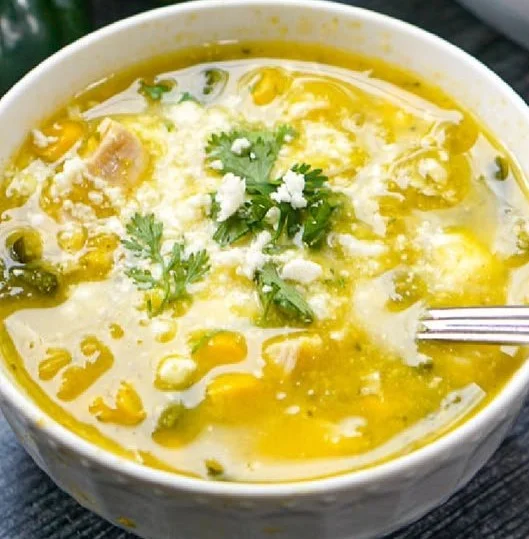 Bowl of easy poblano pepper and corn soup garnished with cilantro