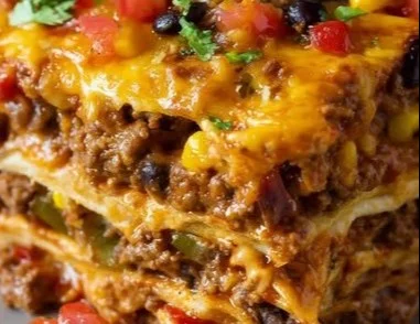 Delicious easy taco casserole dish served in a baking dish with toppings.