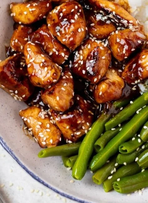 Healthy sesame chicken with vibrant vegetables and rich sesame sauce