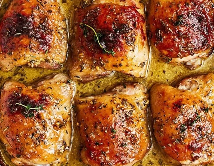 Delicious honey mustard chicken thighs served with vegetables on a plate.