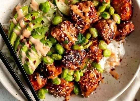 Honey Sriracha Salmon Bowl with colorful fresh vegetables and rice