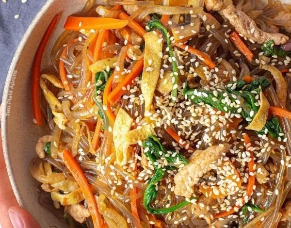 Delicious Japchae - Korean glass noodle stir fry with colorful vegetables.