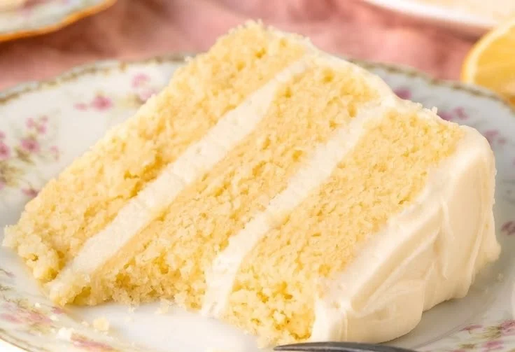 Moist and zesty lemon layer cake topped with cream frosting.