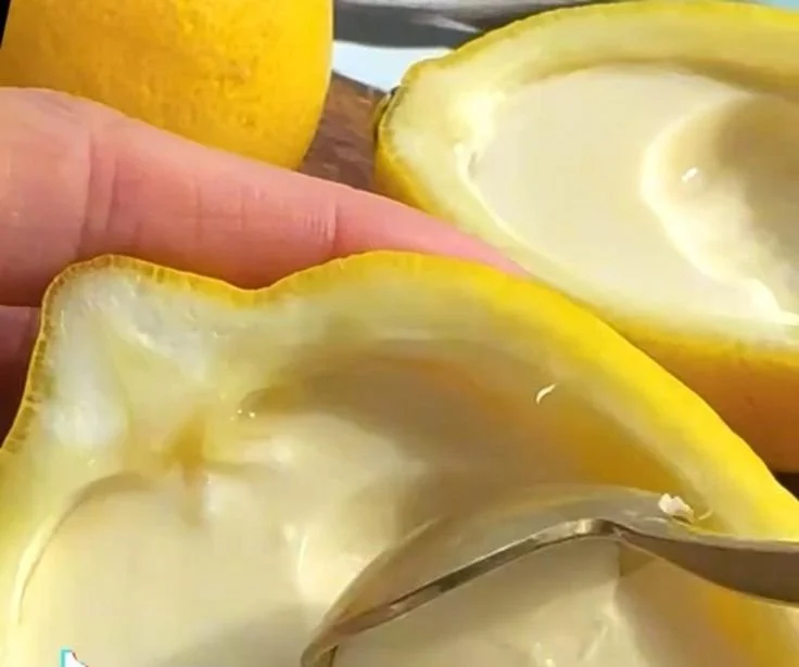 Delicious Lemon Posset dessert in a glass topped with lemon zest