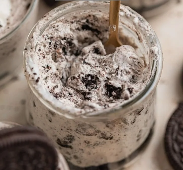 Oreo no-bake cheesecake cups topped with Oreo crumbles.