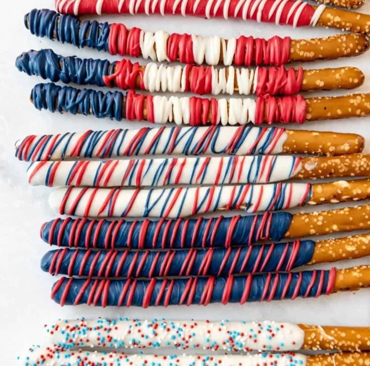Colorful patriotic pretzel rods decorated for Independence Day celebrations.