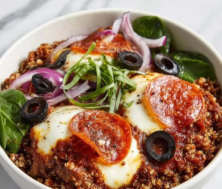 A colorful quick protein bowl filled with grains, vegetables, and protein sources.