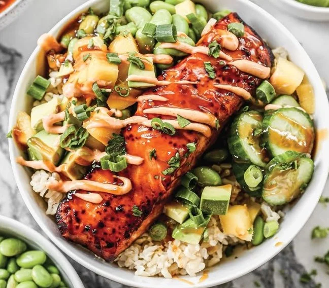 Colorful and healthy Salmon Bowls with fresh vegetables and grains