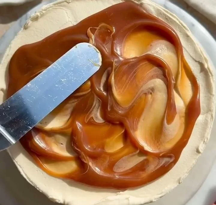 Delicious salted caramel cake with creamy frosting and drizzled caramel