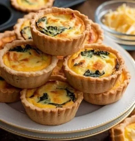 Savory mini quiches selection on a serving platter