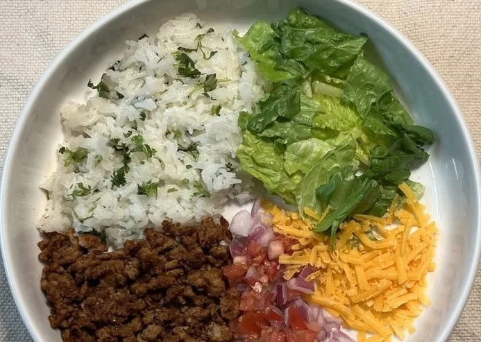 A vibrant Street Corn Chicken Taco Bowl with chicken, corn, and fresh toppings