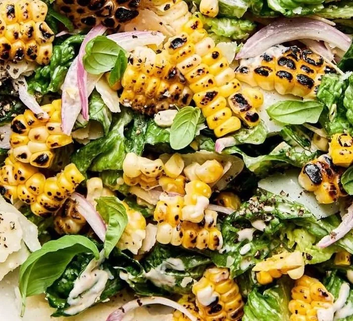 Summer Caesar Salad featuring fresh greens and charred sweet corn